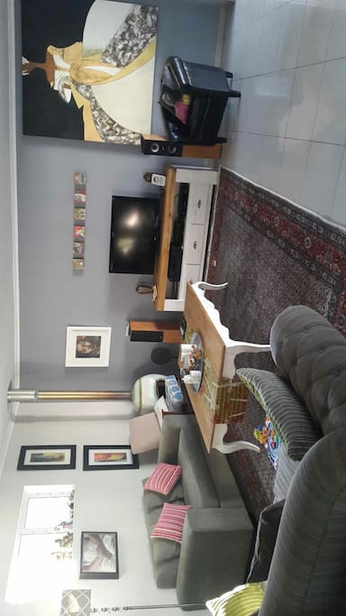 Cable TV, open spacious living room leading out onto a large deck area.