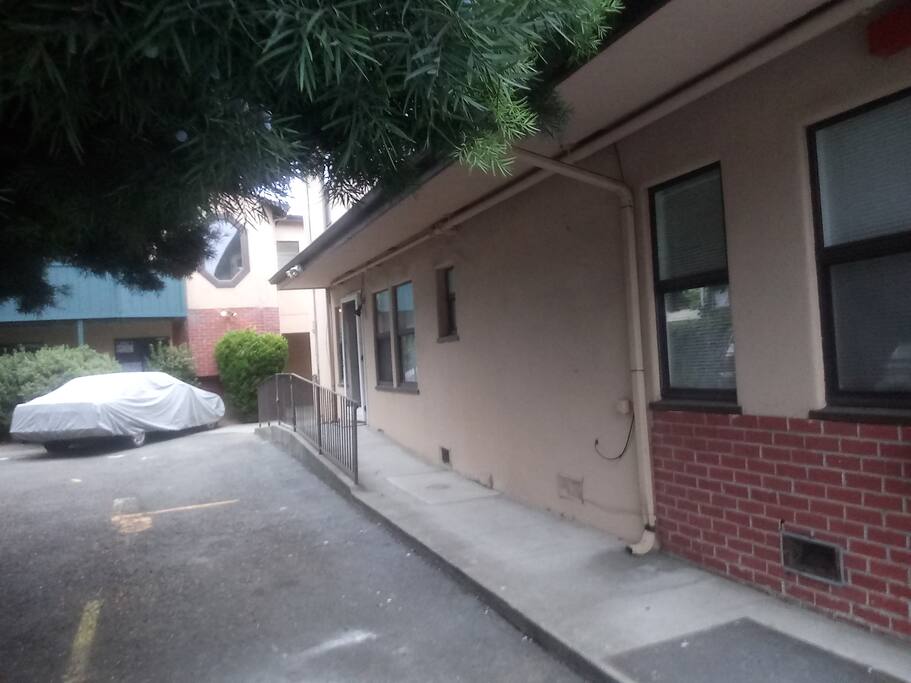 Walk along front building under our shady trees to back building!