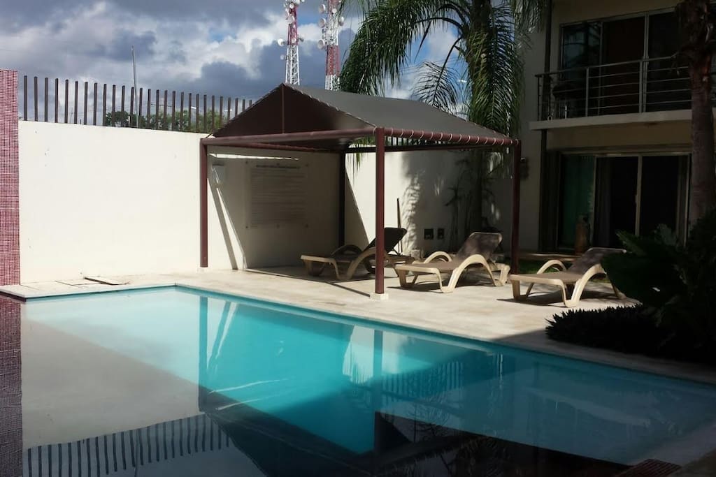 Pool area with sun lounges