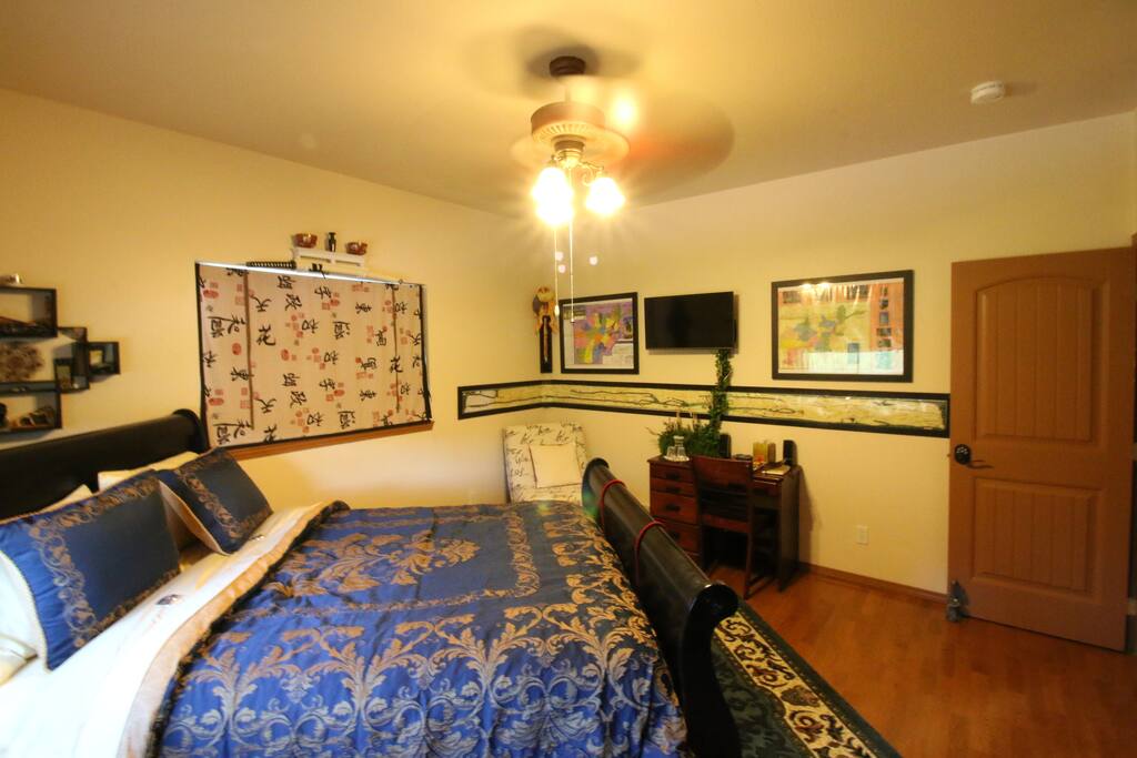 The Eastern room has a writing desk, smart TV, easy chair and wonderful bed.