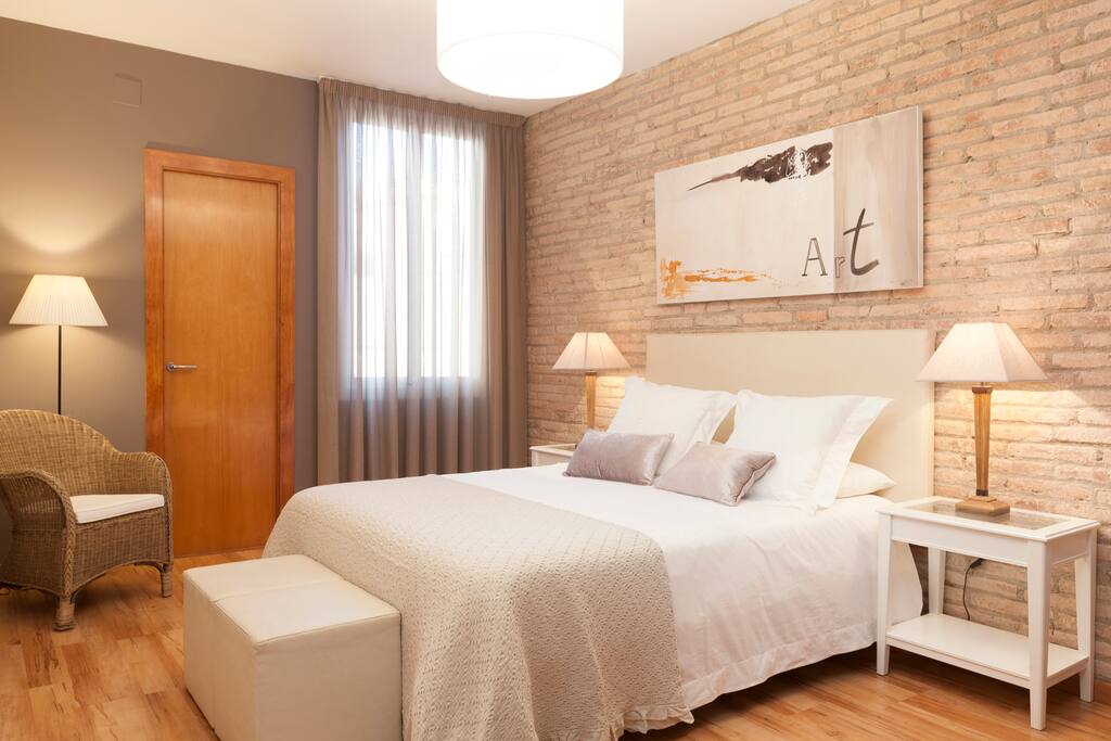 Main bedroom with queen-size bed and bathroom
