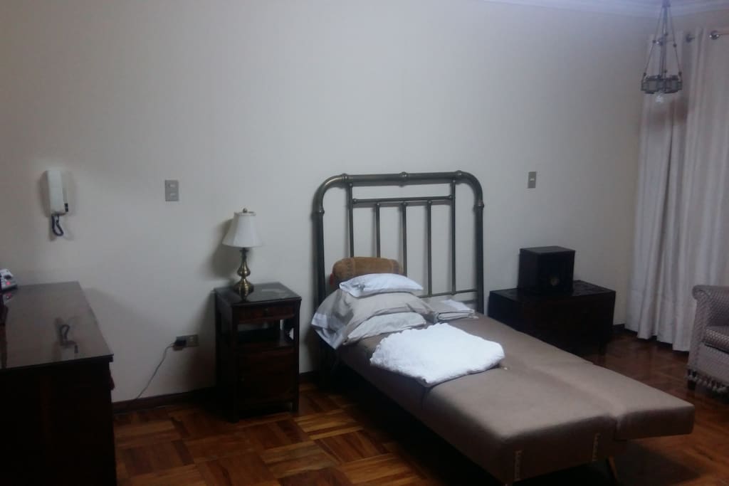 Main bedroom with in suite bathroom with bath tub, seating area and balcony