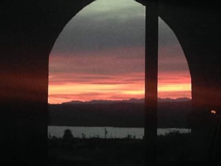 SIT IN YOUR ROOM AND WATCH THE MOUNTAINS, LAKE AND SKY CHANGE COLORS WITH EVERY SPECTACULAR FIRERY SUNSET PERFECTLY CENTERED IN FRONT OF HOUSE!!