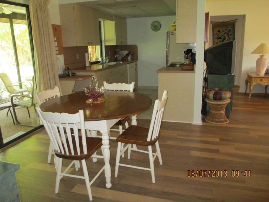 The kitchen is fully furnished, including a new stove and refrigerator. The table expands to seat 10.