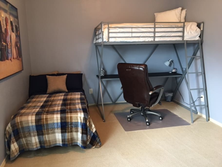 There is a large desk with a lazyboy desk chair. Plenty of space for your computer.