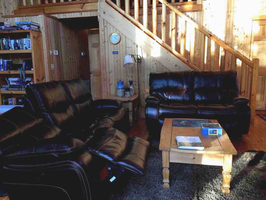 Brand new leather reclining sofa and love seat. What a great place to relax in the great room. Play games or watch movies on DVD or streamed.