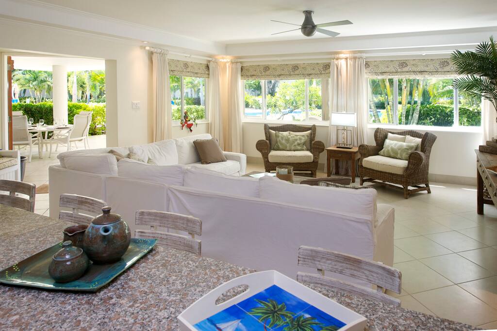 Palm Beach 110 - The open plan living room looks out to the pool area