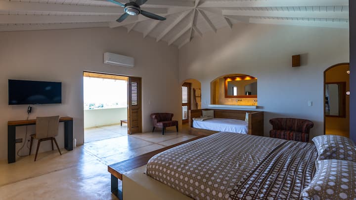 Masterbedroom with king, extra small sofa bed, bathroom, (shower, sinks and toilet), AC, balcony and jacuzzi.