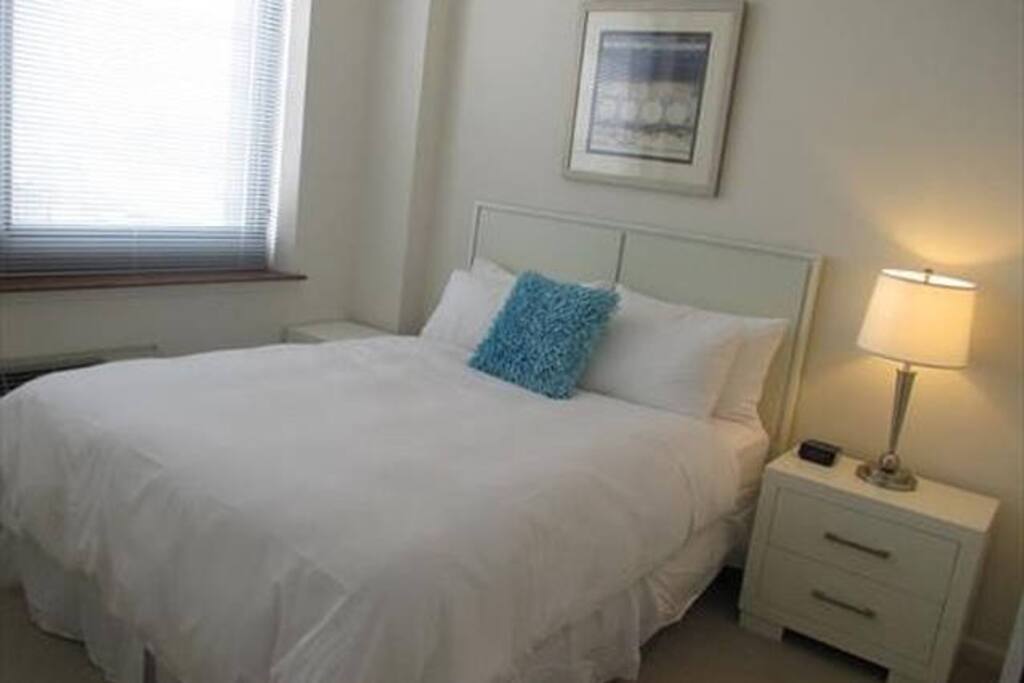 Master bedroom with en-suite bathroom, queen size bed and walk-in closet