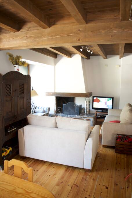 Living room with TV and chimney