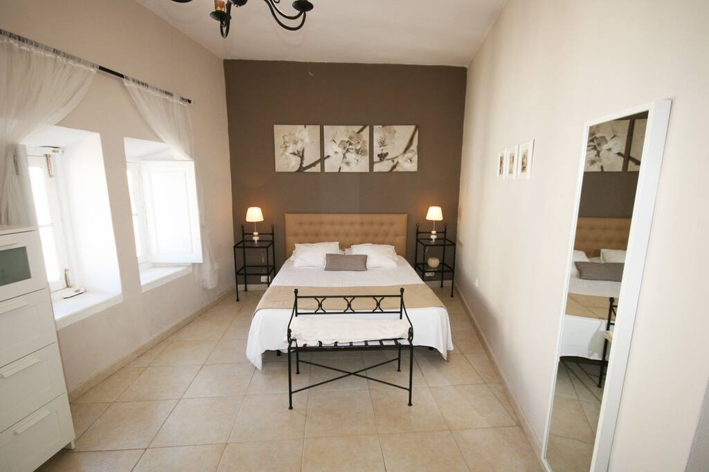 Beautiful and big bedroom with smirror.