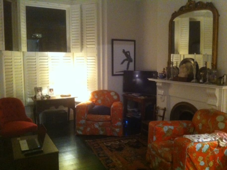 Sitting room with some antique furniture, widescreen TV and netflix etc