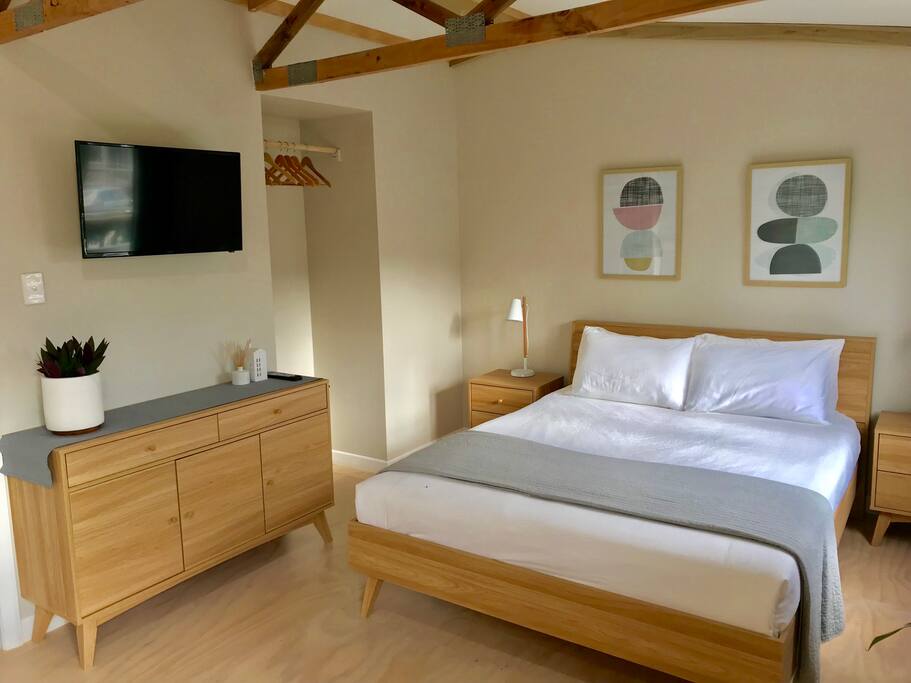 Queen size bed, wardrobe and TV on adjustable bracket