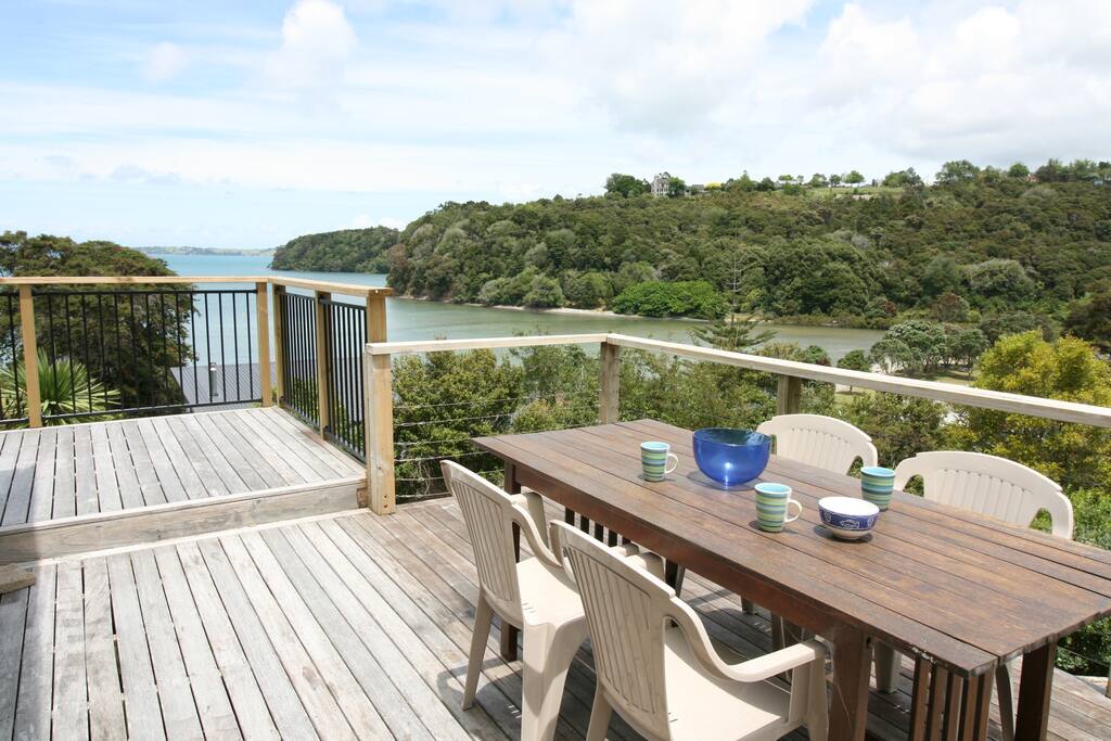 Outdoor dining and BBQ area. There is a second table on the front deck for evening shade.