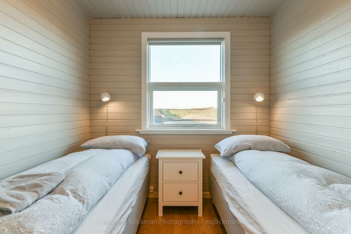 The second bedroom has 2 single beds.