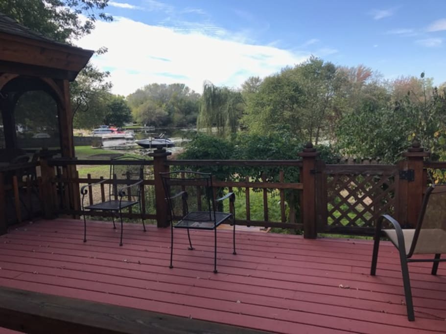 Large two story deck with screened in gazebo for views of sunset. Deck has plenty of seating. Picnic table on both levels. Enjoy grilling out using the stainless BBQ or go fishing using some poles we put out.
