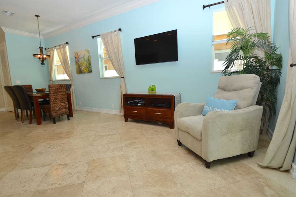 Spacious Open Living Area Overlooks Pool Lounge + Features Leather Sleeper Sofa + Chair + LED HD TV Entertainment Center...