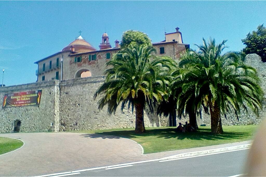 The view up to the old town with apartment over the archway. Church behind