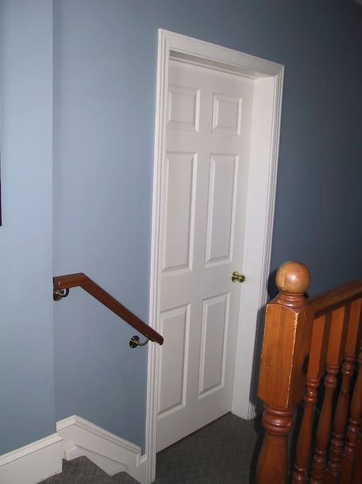Entry to suite on mezzanine floor of house