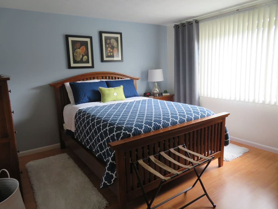 Master Bedroom with queen size bed and a half bathroom