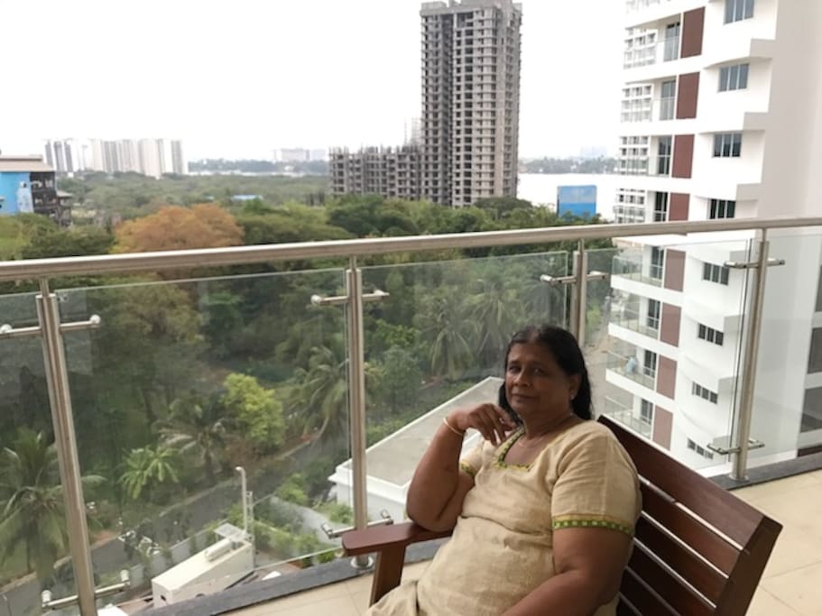 This is the balcony adjacent to Living room where we can get a view of the sea and Bird sanctuary. It also has a hanging swing for comfort. We can view the gardens and clubs and other activities on the ground