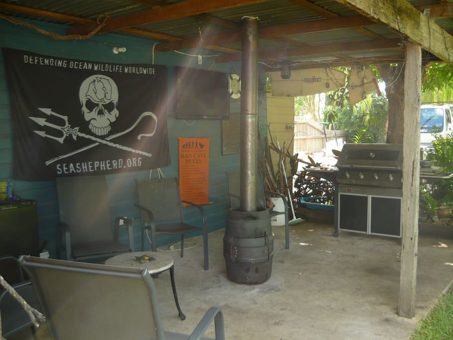 This is the 'mancave' with a barbeque and wood heater.