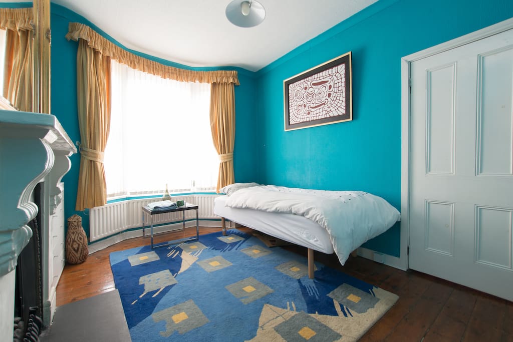 Big south facing bay window letting morning light in Bedroom