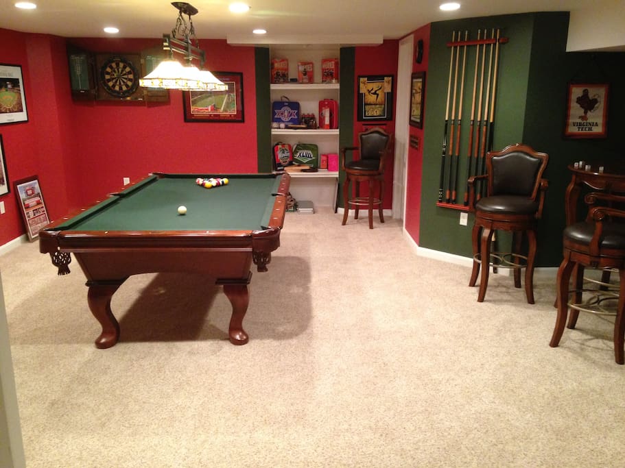 Entertainment room with pool table, darts and refrigerator