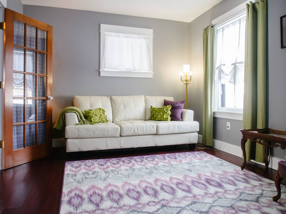 Living room with sofa bed, writing desk, and TV can be closed off for privacy