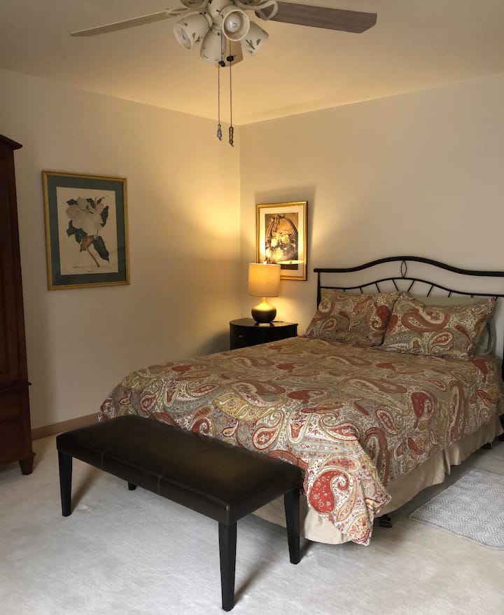 Bedroom with queen size bed, comfortable mattress, and quality bedding.