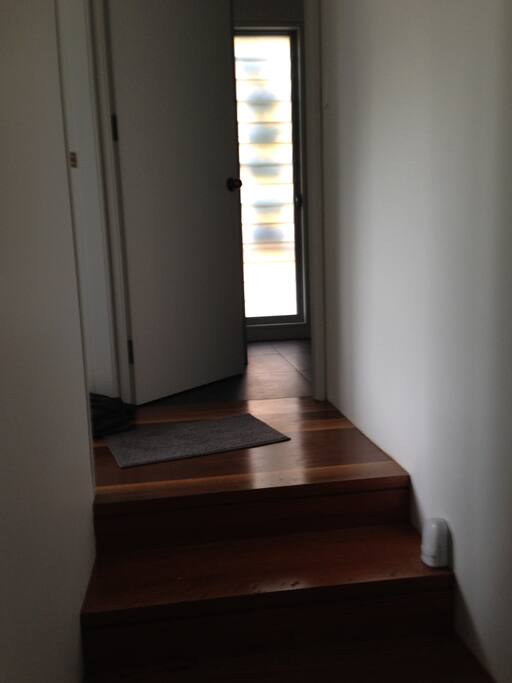 Up 4 stairs to bedroom and private bathroom