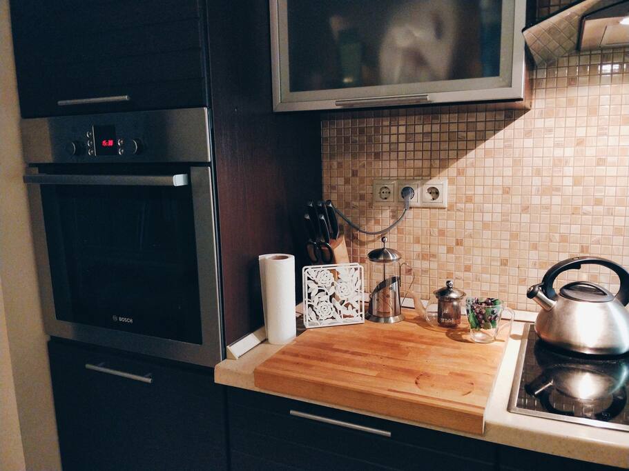 Kitchen cpmpleted with an oven, stove, refrigerator