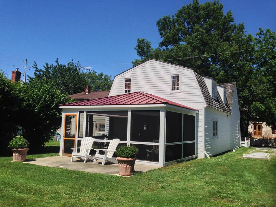Rear of house with large screened porch with BBQ deck