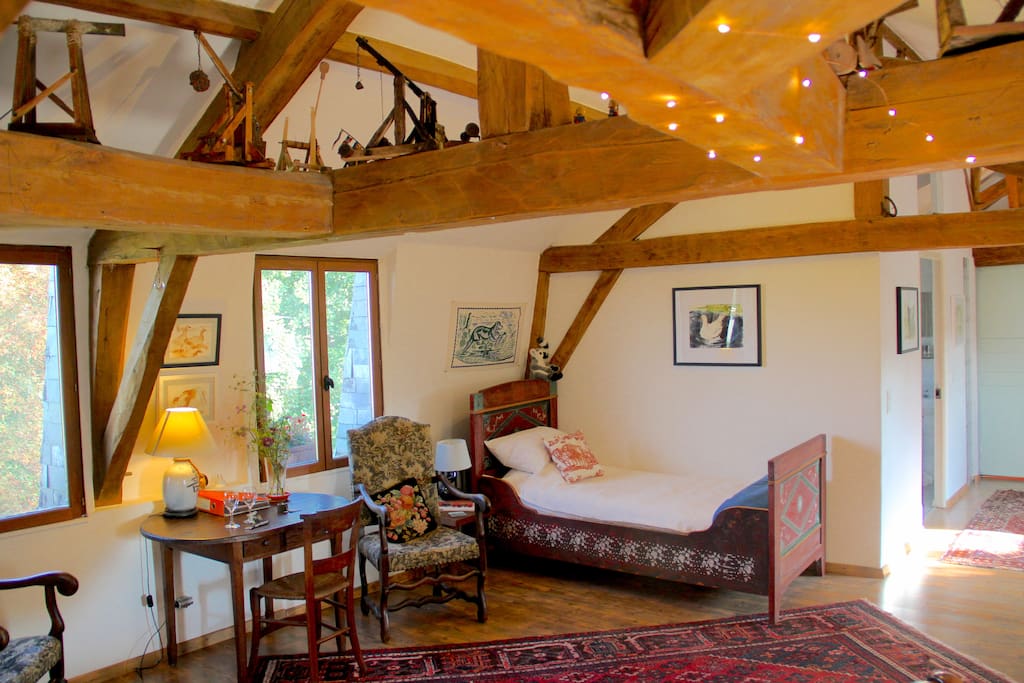 Single hand painted bed and Trebuchet models on the beams.
