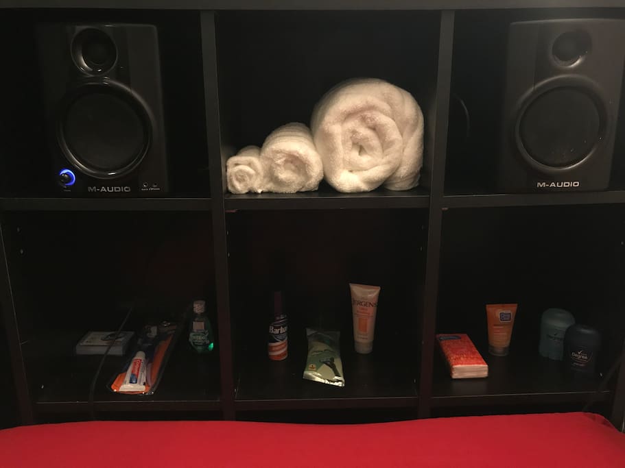 Would you look at all those amenities-towels, and speakers, even hygiene products incase you forgot some