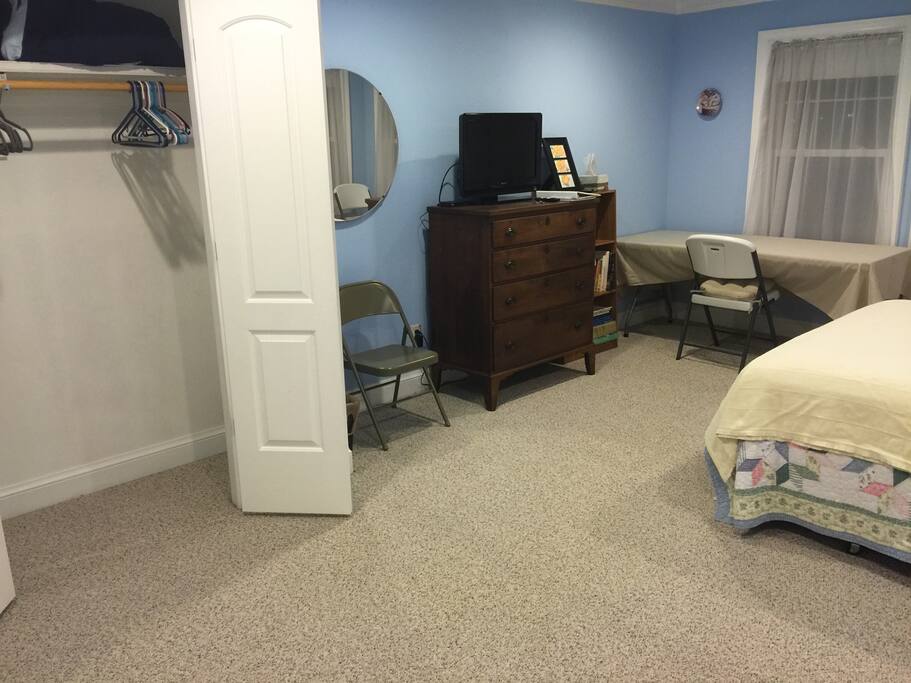 View from the attached bathroom showing the closet and mirror.
