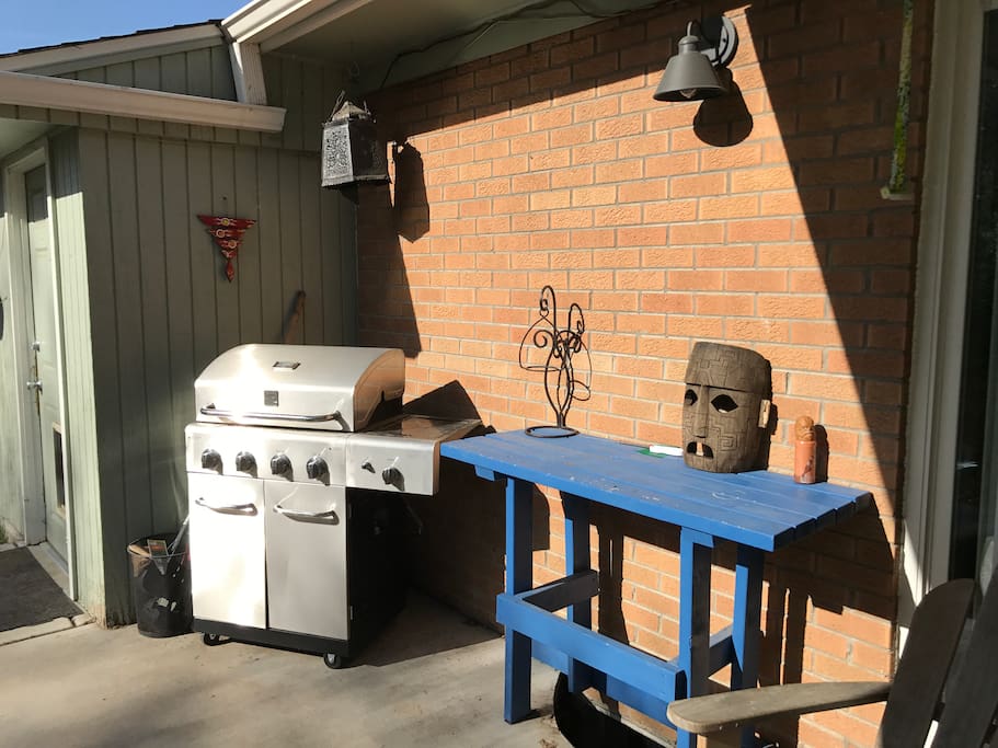 Patio area with gas grill.