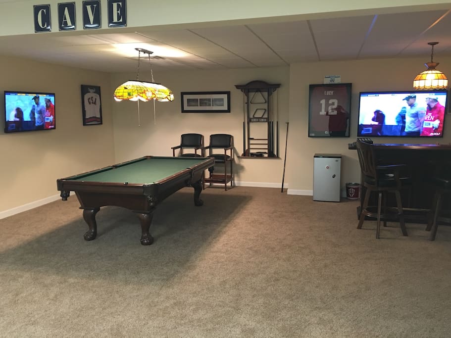 Pool table with mounted TVs to watch the Hoosiers!