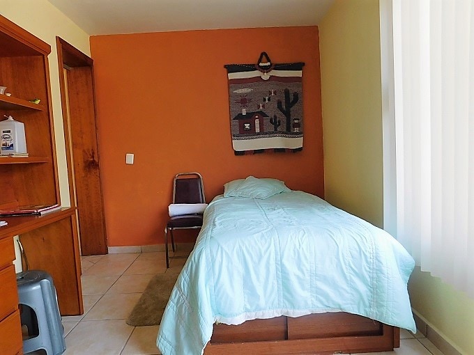 Bedroom with  2 beds, one single