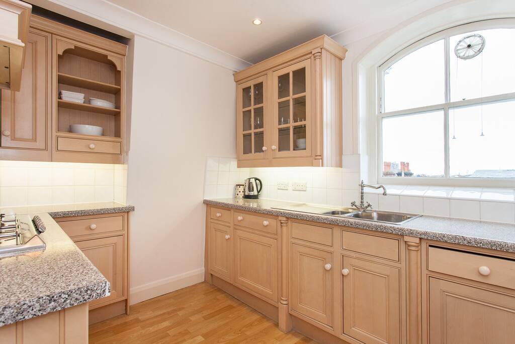 Kitchen, equipped for cooking.