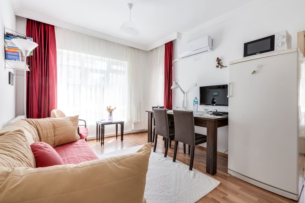 Living room; sofa, AC, full HD cable TV (has many international channels), and dining table.