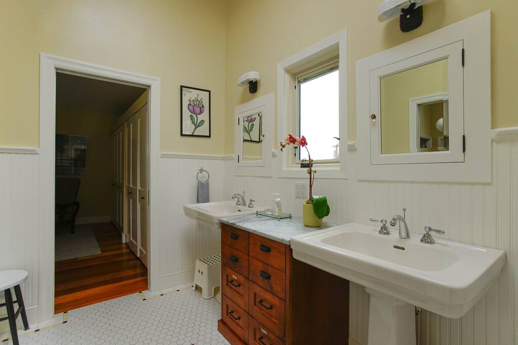 Double sinks with custom craftsman details. Plenty of room to get ready.