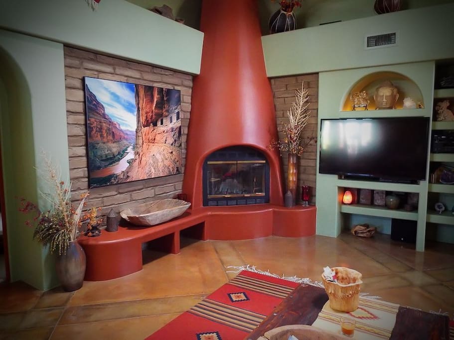 Main house living area also has a fireplace and large tv.