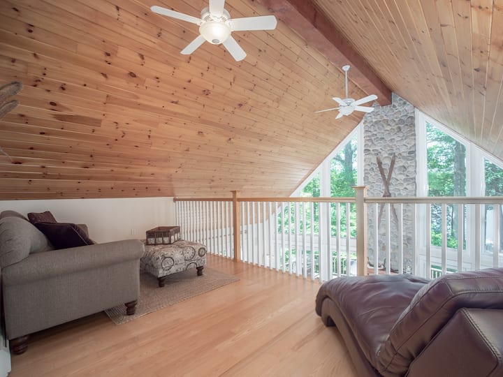 The loft boasts the best lake views in the house, and is a great reading space