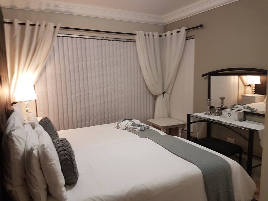 Twin beds in 2nd room with door open on to balcony