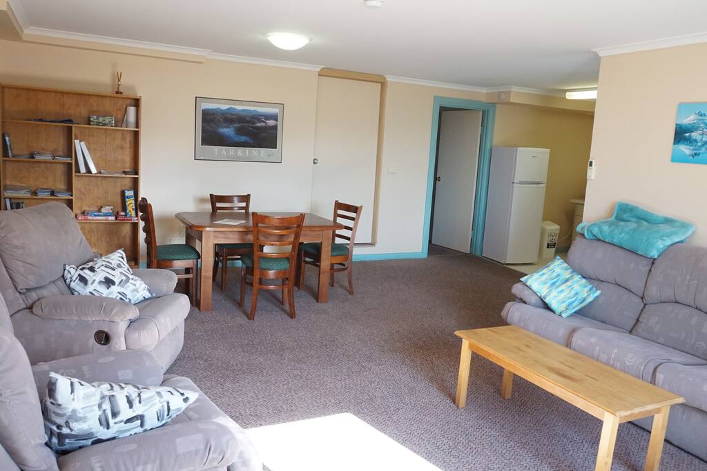 View of lounge area as you enter. Plenty of outlets to charge your devices. Enjoy eating at our new extendable dining table.