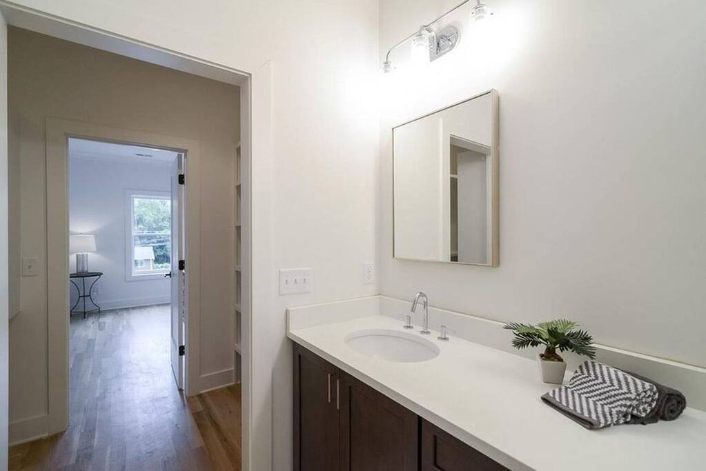 Bathroom and closet leading into bedroom