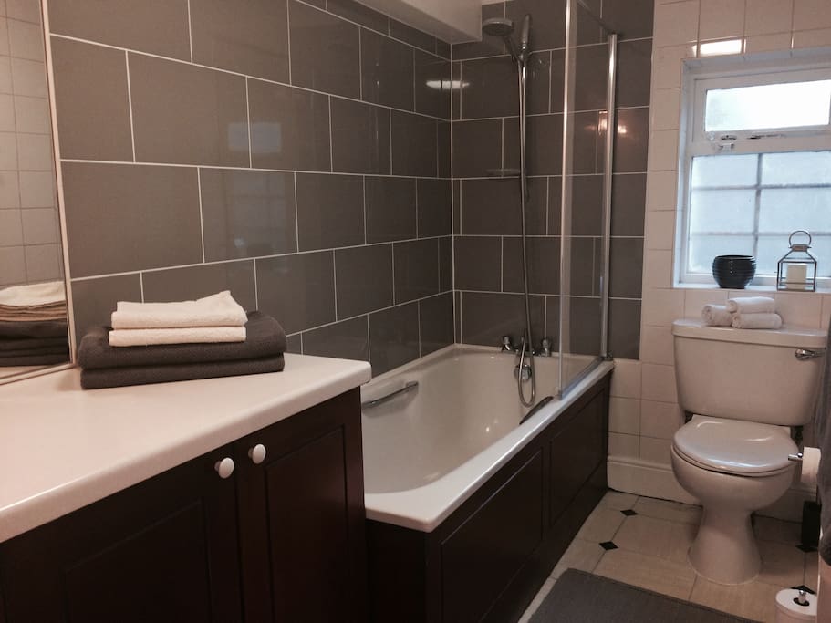 Bathroom with bathtub and shower