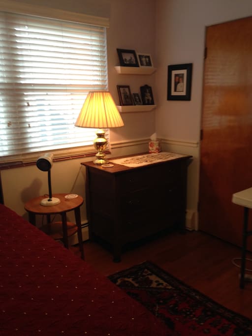 Dresser and window that looks out on the back patio