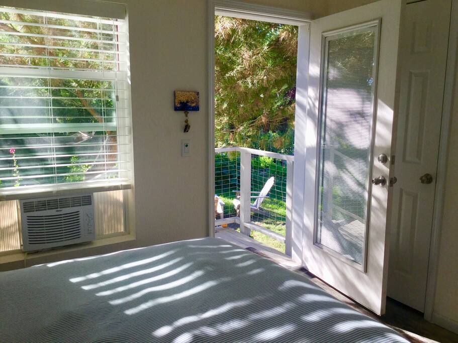 Your room’s private entrance door leading to gardens and outside seating.